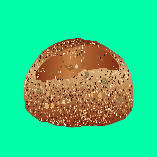 Heritage seed bread loaf with a seeded crust and rustic golden finish.